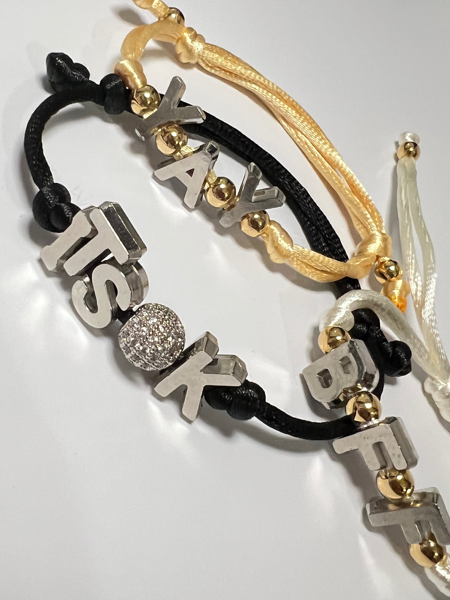 MEAN’ LETTERING BRACELETS